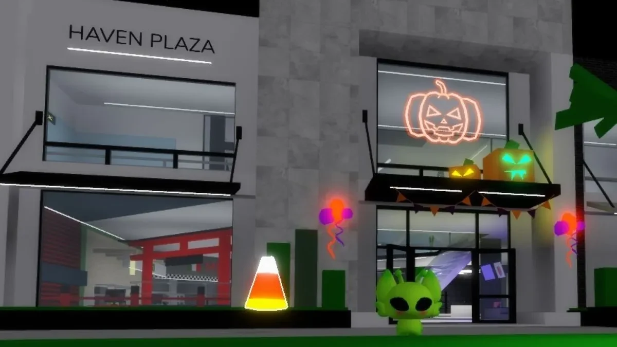 Haven Plaza entrance with a glowing Candy Corn on the ledge in front.