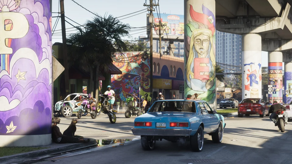 Blue two-door car on a Vice City street